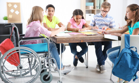 AdobeStock 201666160   kids working at table