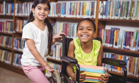 AdobeStock 89369257   girls and wheelchair